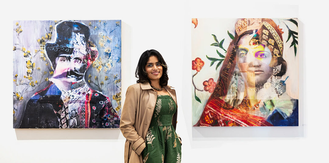 Nimisha Doogarwal, stands in front of two of her artworks
