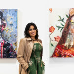Nimisha Doogarwal, stands in front of two of her artworks