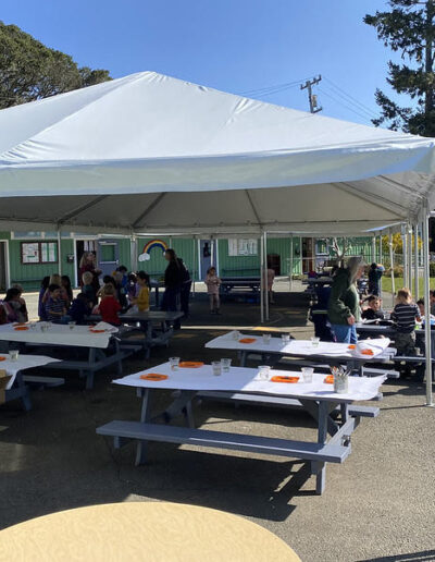 outdoor art gathering under shade tents