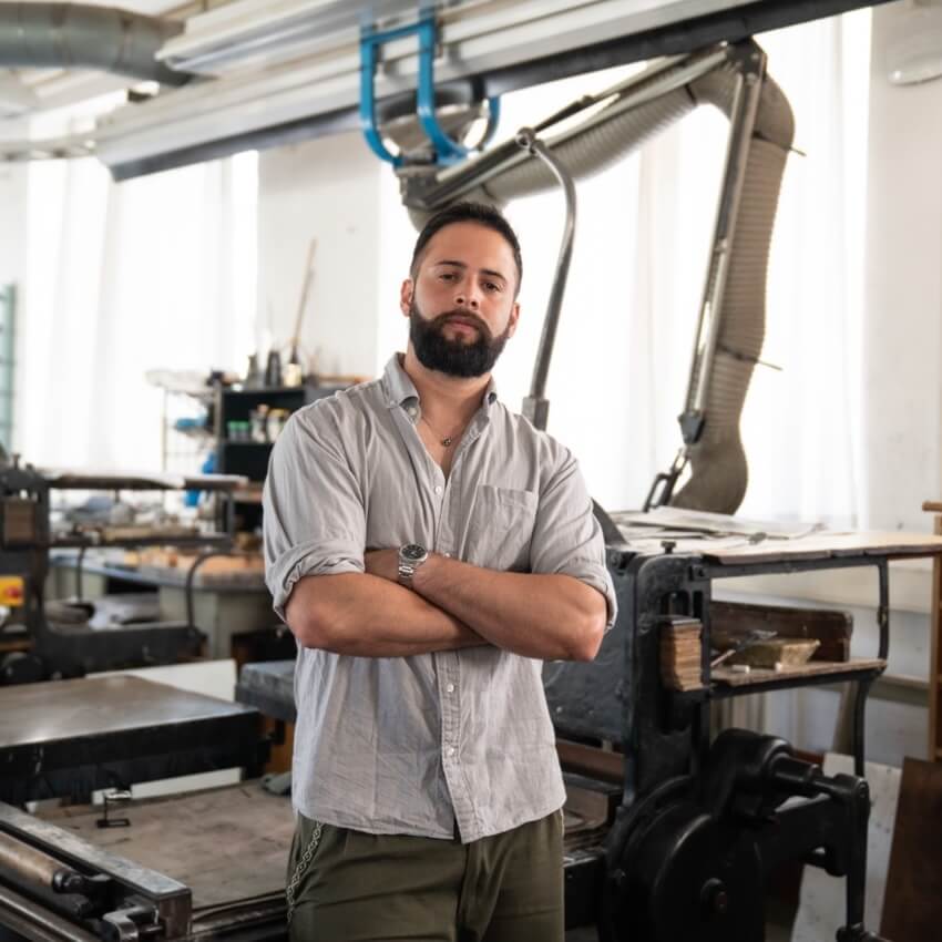 Milton Homann standing in a workshop